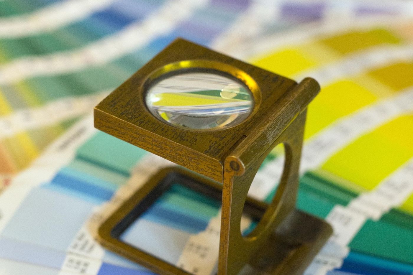 Colour bars and a loupe on a press sheet